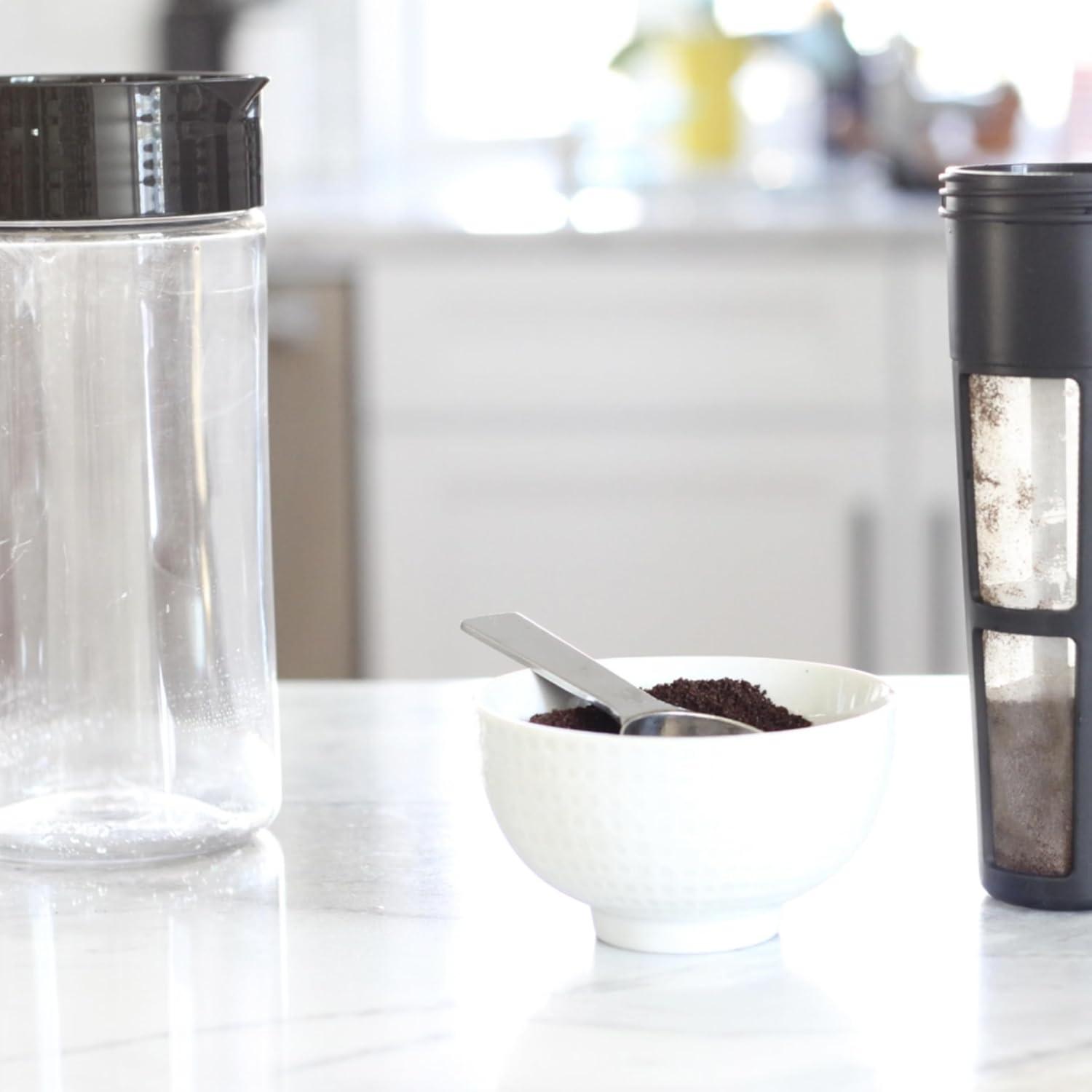 imageTakeya Tritan Cold Brew Coffee Maker Airtight Pitcher with LeakFree Lid BPAFree Cold Brew Maker with Silicone Handle DishwasherSafe Pitcher for Homemade Cold Brew 1 Quart WhiteBlack