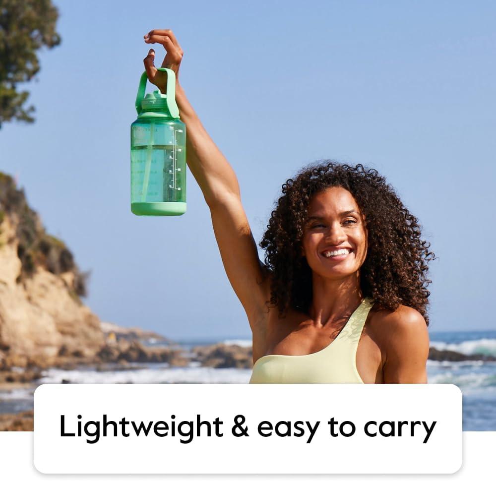 imageTakeya Tritan Motivational Water Bottle with Straw Lid Durable BPAFree With Time Marker Leakproof ampamp NonSlip Bumper 64 oz Vivacity PurpleStormy Black