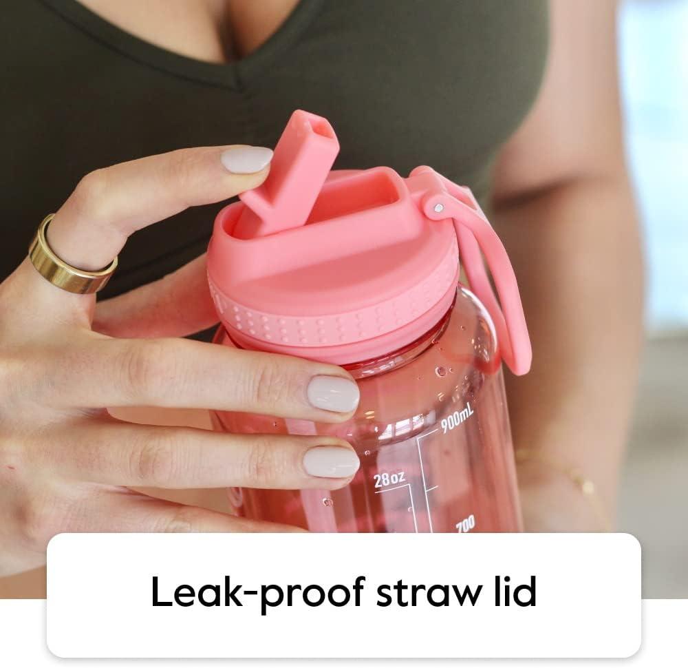 imageTakeya Tritan Motivational Water Bottle with Straw Lid Durable BPAFree With Time Marker Leakproof ampamp NonSlip Bumper 64 oz Vivacity PurpleStormy Black