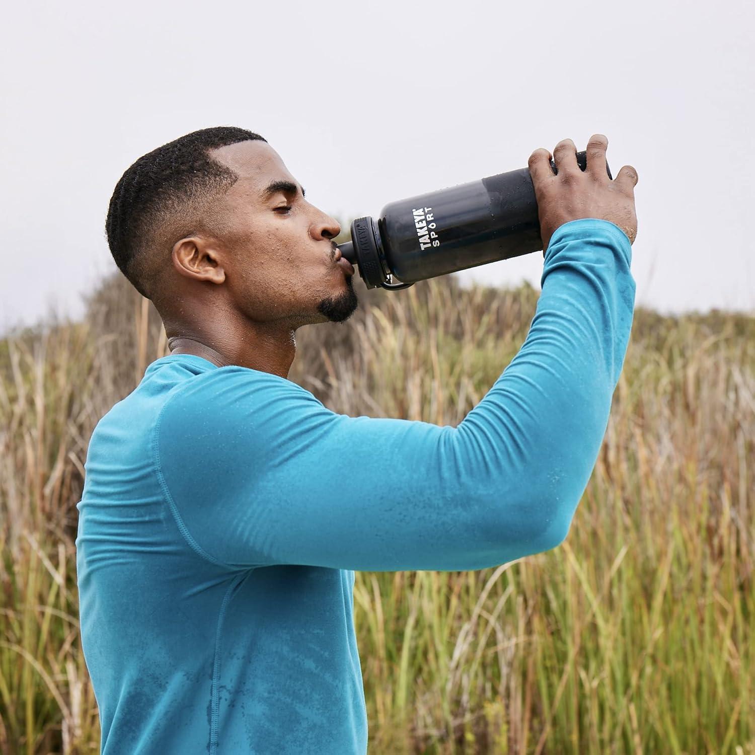 imageTakeya Tritan Sport Water Bottle with Spout Lid BPAFree ampamp DishwasherSafe Water Bottle Reusable Bottle with Lid Handle Simple LeakProof Water Bottle 32 oz Pink SweepPink Sweep